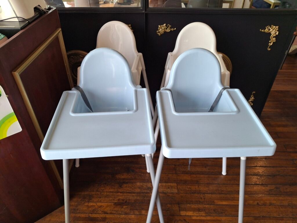 Clean wooden high chairs available for families dining with infants and toddlers at the restaurant.